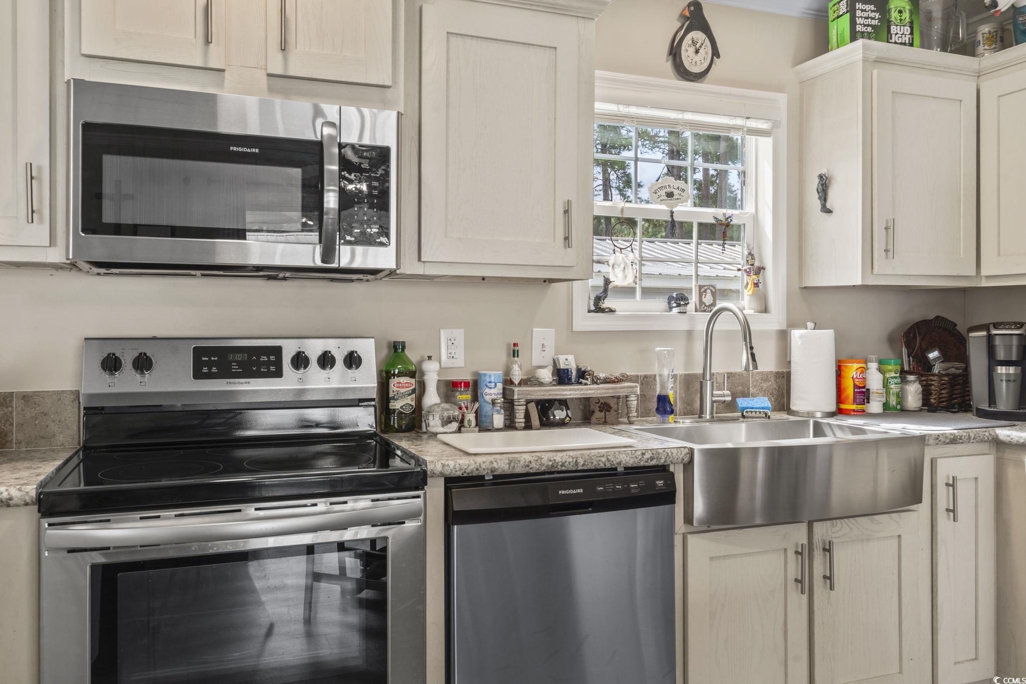 79 Offshore Drive Murrells Inlet, SC 29576 - Photo 5 of 31 Kitchen featuring stainless steel appliances and light countertops
