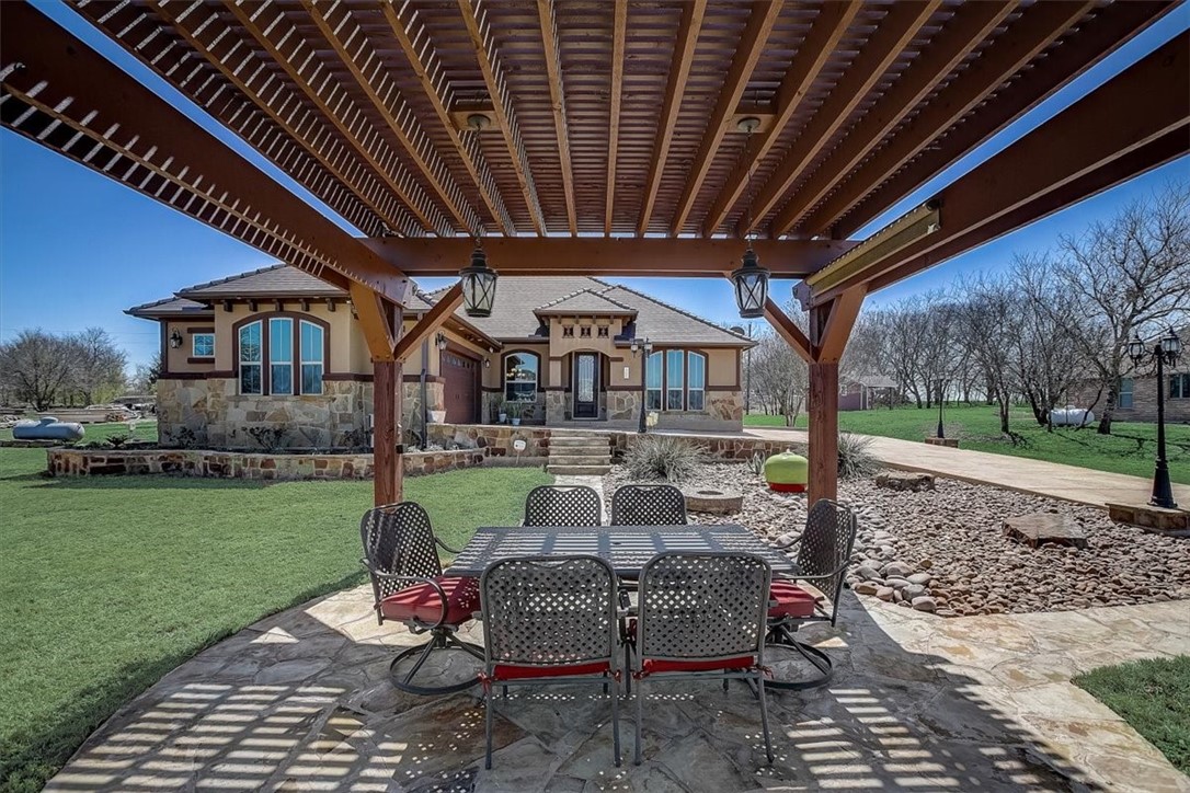 Enjoy your morning coffee under the arbor.