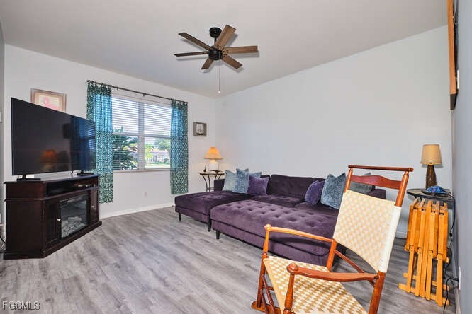 20012 Heatherstone Way, Unit 1 Estero, FL 33928 - Photo 13 of 48 a living room with furniture and a flat screen tv