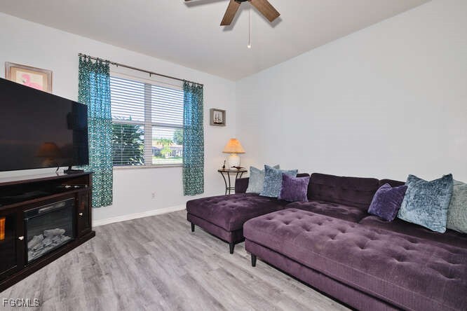 20012 Heatherstone Way, Unit 1 Estero, FL 33928 - Photo 14 of 48 a living room with furniture and a flat screen tv