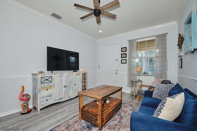 20012 Heatherstone Way, Unit 1 Estero, FL 33928 - Photo 2 of 48 a living room with furniture and a flat screen tv