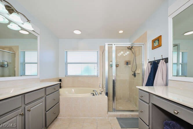 20012 Heatherstone Way, Unit 1 Estero, FL 33928 - Photo 24 of 48 a bathroom with a double vanity sink toilet and shower