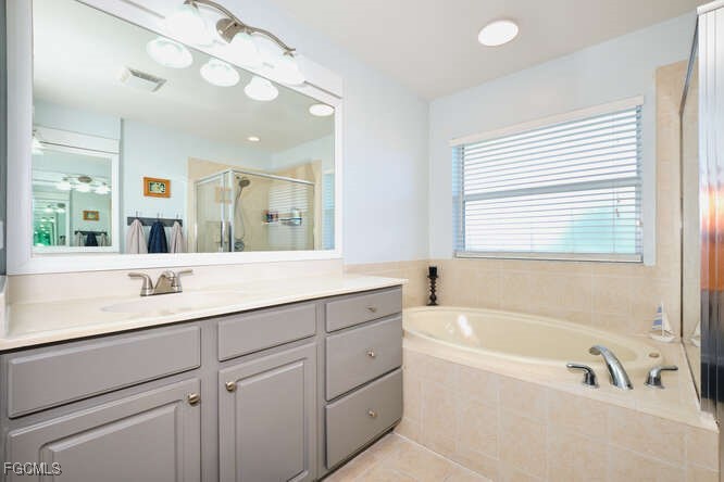 20012 Heatherstone Way, Unit 1 Estero, FL 33928 - Photo 25 of 48 a bathroom with a tub a sink and a window