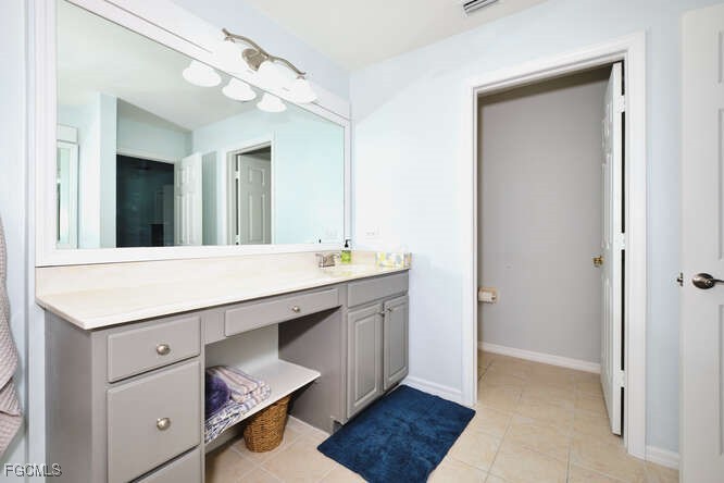 20012 Heatherstone Way, Unit 1 Estero, FL 33928 - Photo 26 of 48 a bathroom with a sink a vanity and a mirror