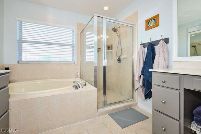 20012 Heatherstone Way, Unit 1 Estero, FL 33928 - Photo 28 of 48 a bathroom with a bathtub and a shower