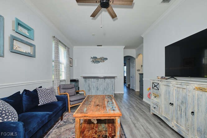 20012 Heatherstone Way, Unit 1 Estero, FL 33928 - Photo 3 of 48 a living room with furniture and a flat screen tv