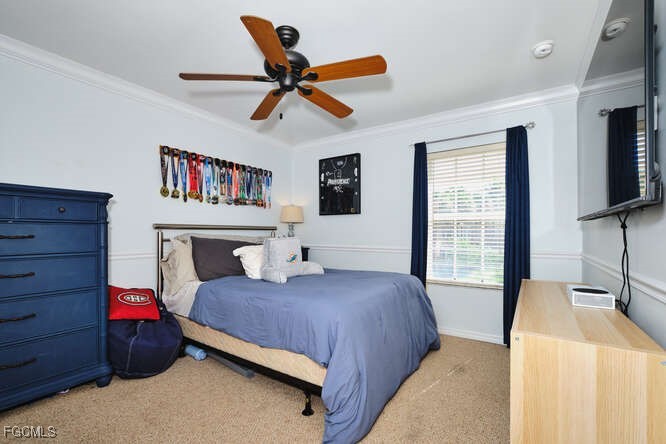 20012 Heatherstone Way, Unit 1 Estero, FL 33928 - Photo 31 of 48 a bedroom with a bed and a flat screen tv
