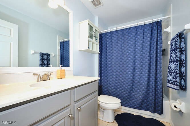20012 Heatherstone Way, Unit 1 Estero, FL 33928 - Photo 34 of 48 a bathroom with a sink a toilet and a mirror