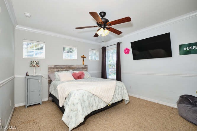 20012 Heatherstone Way, Unit 1 Estero, FL 33928 - Photo 36 of 48 a bedroom with a large bed and a flat screen tv