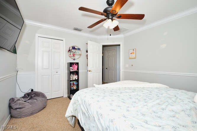 20012 Heatherstone Way, Unit 1 Estero, FL 33928 - Photo 38 of 48 a bedroom with a bed and a chandelier