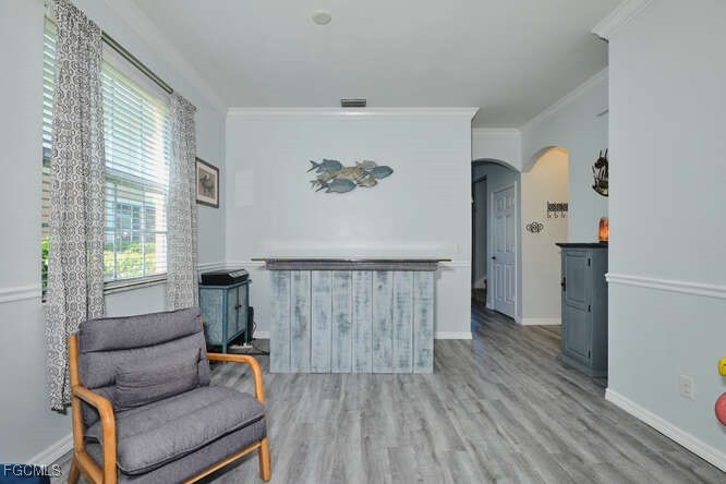 20012 Heatherstone Way, Unit 1 Estero, FL 33928 - Photo 7 of 48 a living room with furniture and a wooden floor