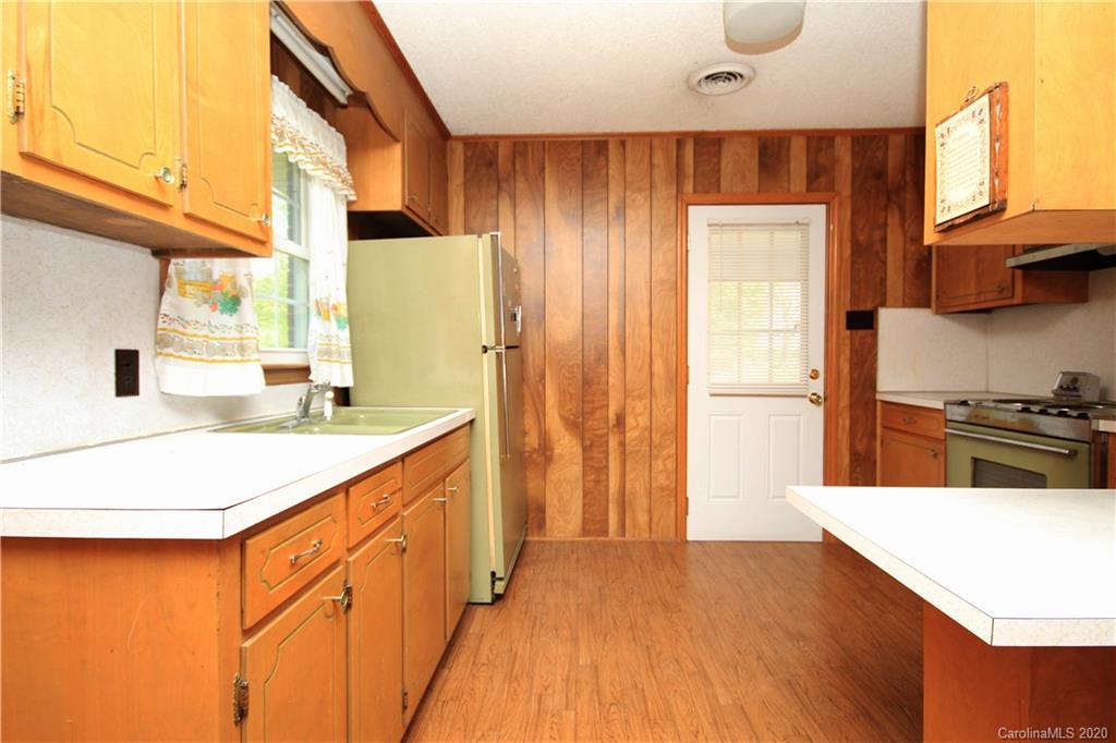 2688 South Potter Road Heath Springs, SC 29058 - Photo 3 of 12 a kitchen with stainless steel appliances a refrigerator and a stove