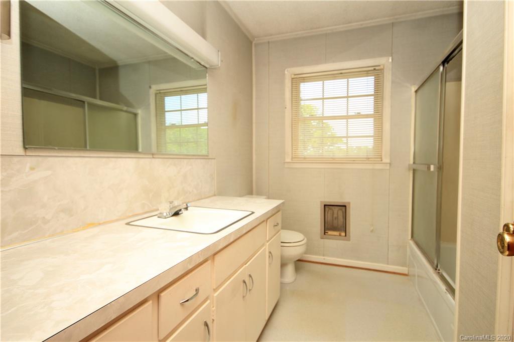 2688 South Potter Road Heath Springs, SC 29058 - Photo 7 of 12 a bathroom with a sink a toilet and tub