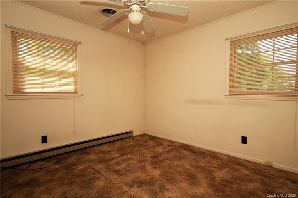 2688 South Potter Road Heath Springs, SC 29058 - Photo 8 of 12 an empty room with a window