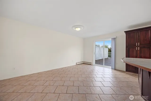 a view of an empty room with a fireplace