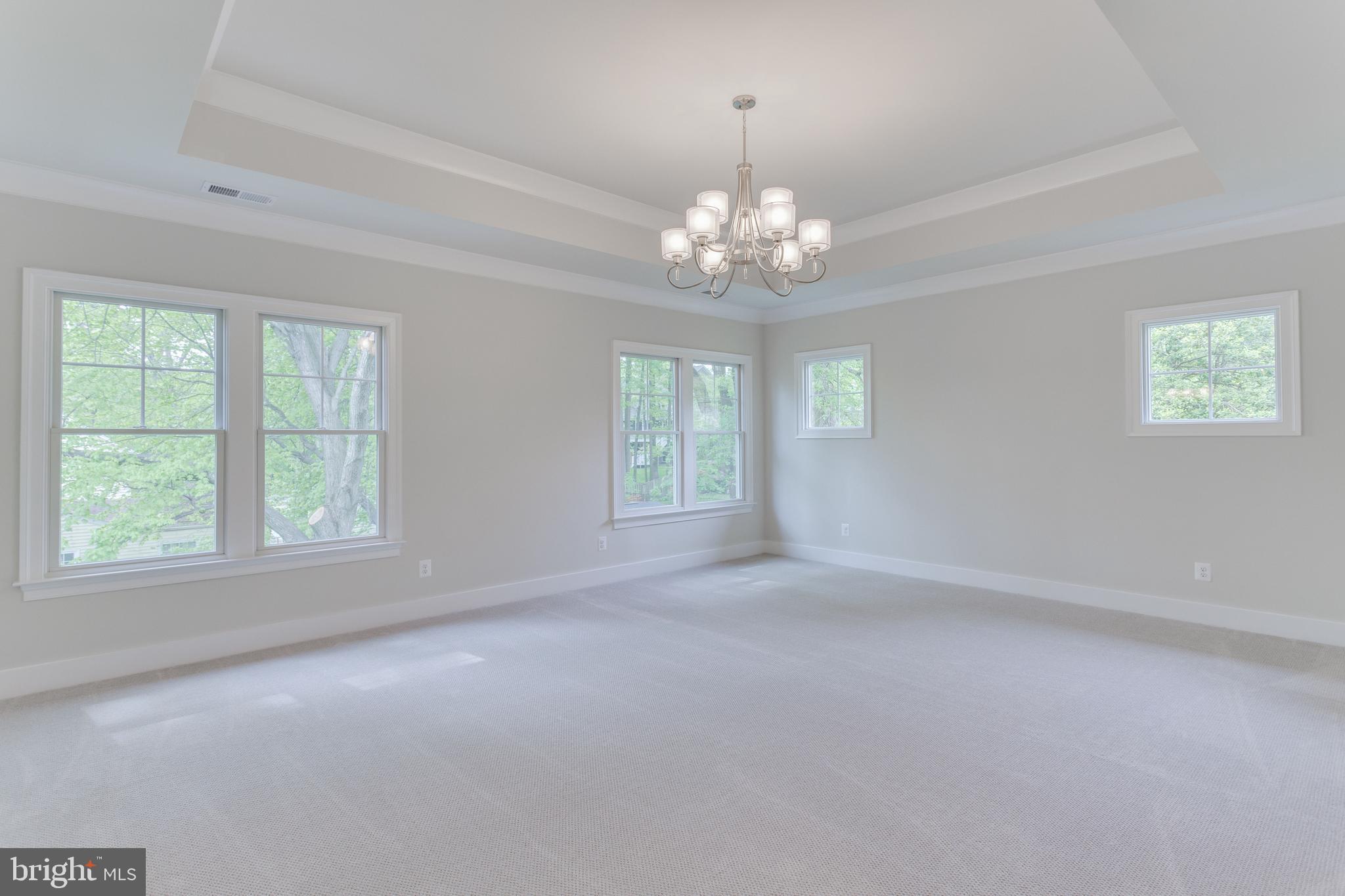 307 Cabin Road Southeast Vienna, VA 22180 - Photo 19 of 25 an empty room with windows and chandelier