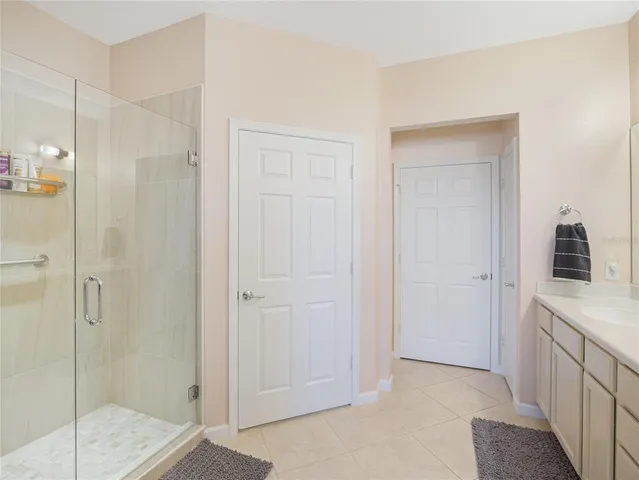a kitchen with granite countertop white cabinets stainless steel appliances and a sink