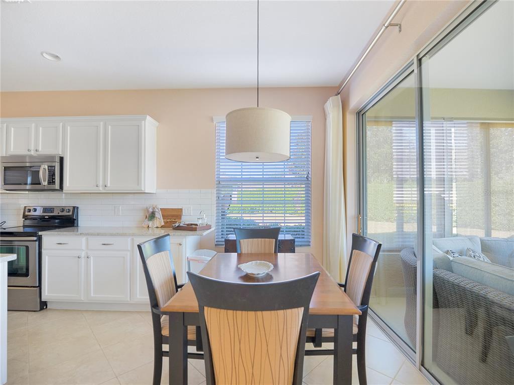 6776 Southwest 91st Circle Ocala, FL 34481 - Photo 24 of 60 a view of a dining room with furniture window and outside view