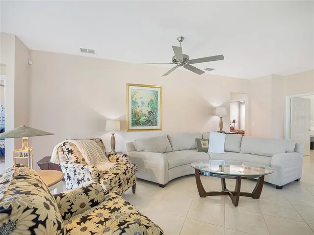 a kitchen with stainless steel appliances kitchen island granite countertop a refrigerator and a sink