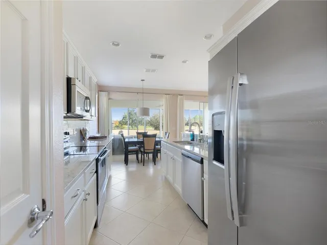 a view of a livingroom with workspace and a couch