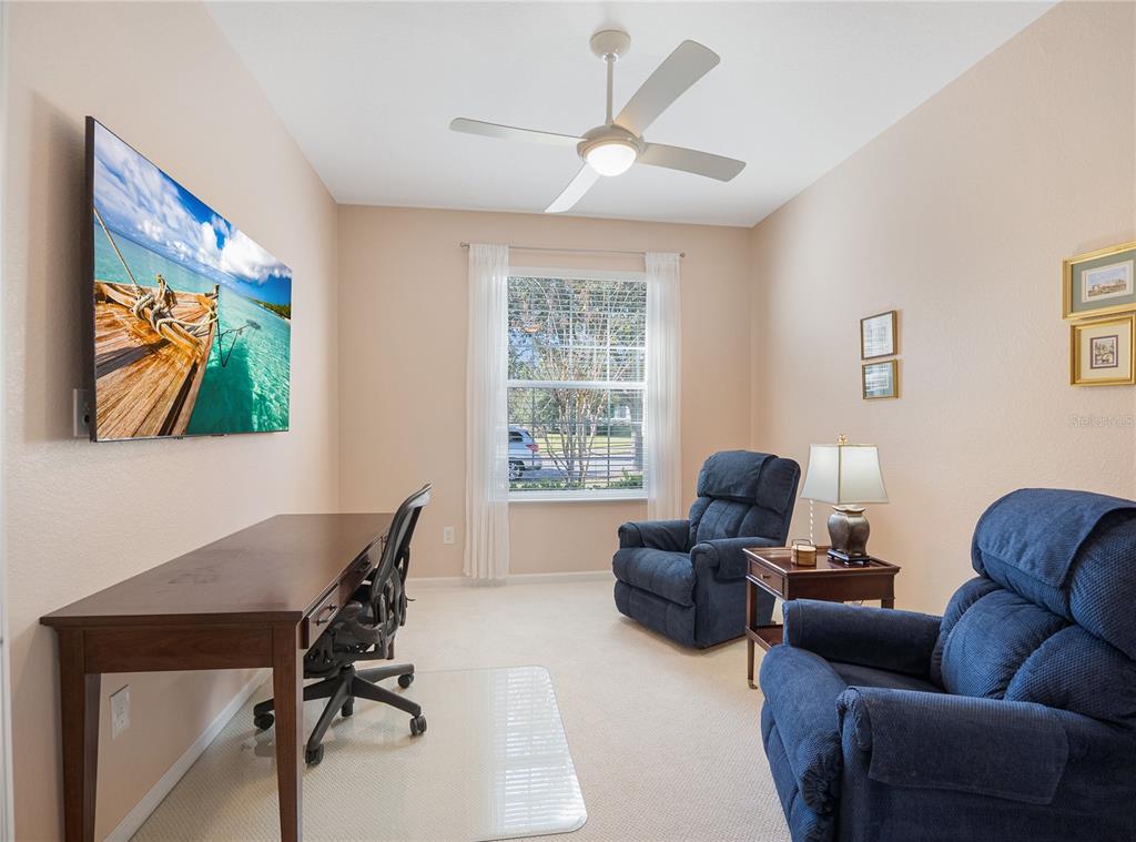 6776 Southwest 91st Circle Ocala, FL 34481 - Photo 36 of 60 a view of a livingroom with workspace and a couch