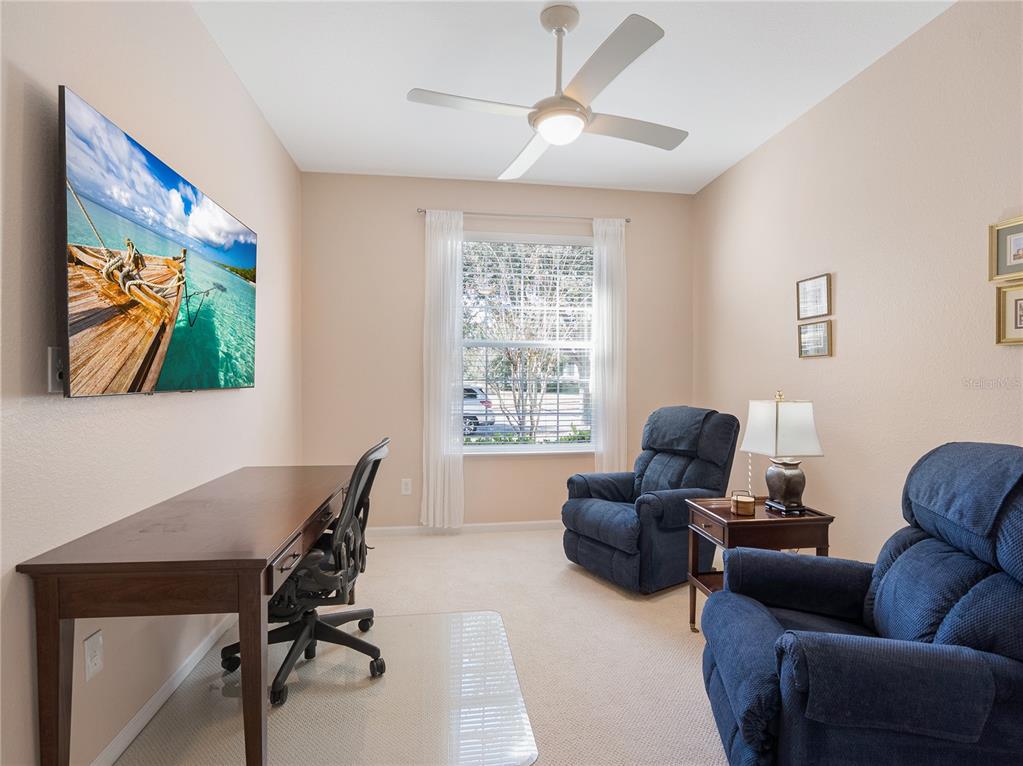 6776 Southwest 91st Circle Ocala, FL 34481 - Photo 37 of 60 a view of a livingroom with workspace and a couch