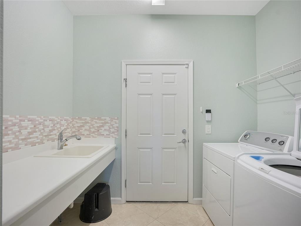 6776 Southwest 91st Circle Ocala, FL 34481 - Photo 40 of 60 a utility room with dryer and washer