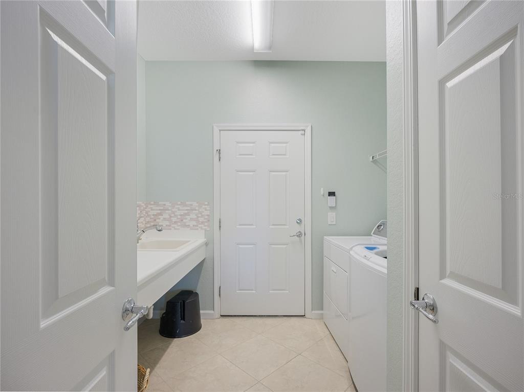 6776 Southwest 91st Circle Ocala, FL 34481 - Photo 41 of 60 a room with a washer and dryer