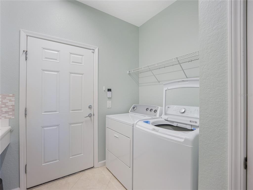 6776 Southwest 91st Circle Ocala, FL 34481 - Photo 42 of 60 a utility room with dryer and washer