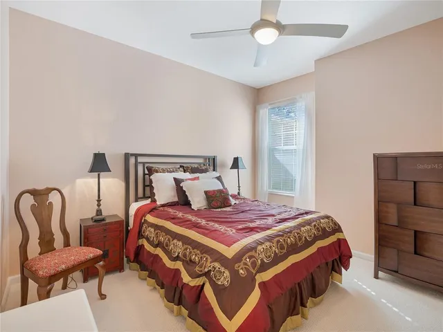 a living room with a floor to ceiling window and floor to ceiling window