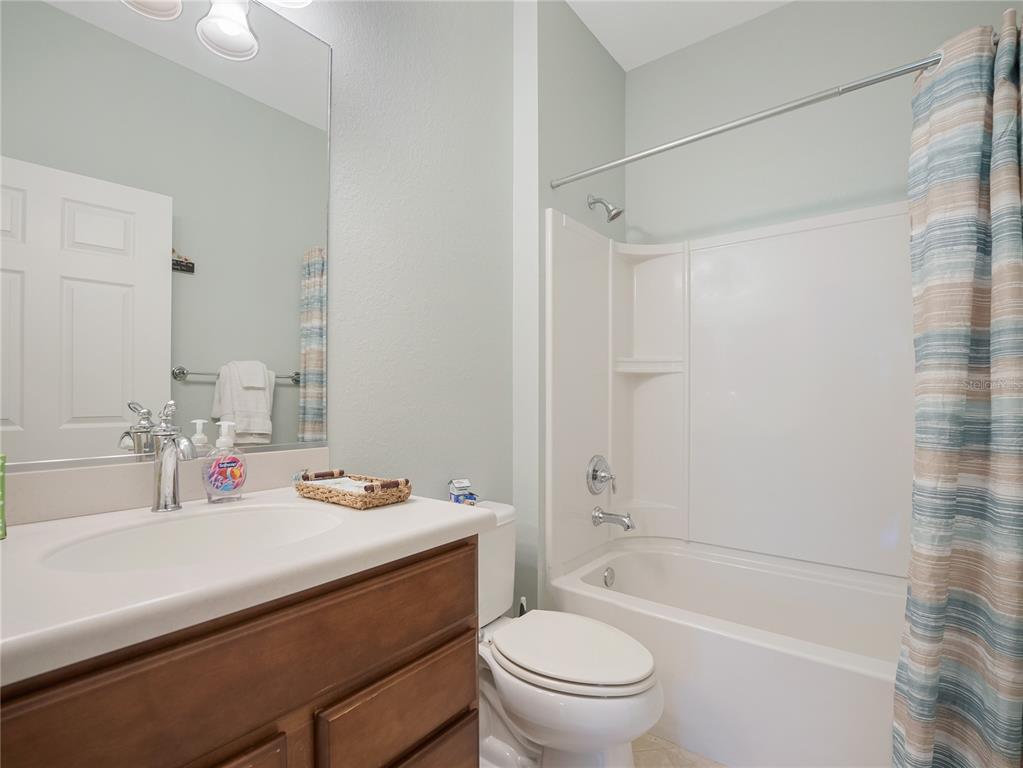 6776 Southwest 91st Circle Ocala, FL 34481 - Photo 47 of 60 a bathroom with a sink a toilet and a bathtub