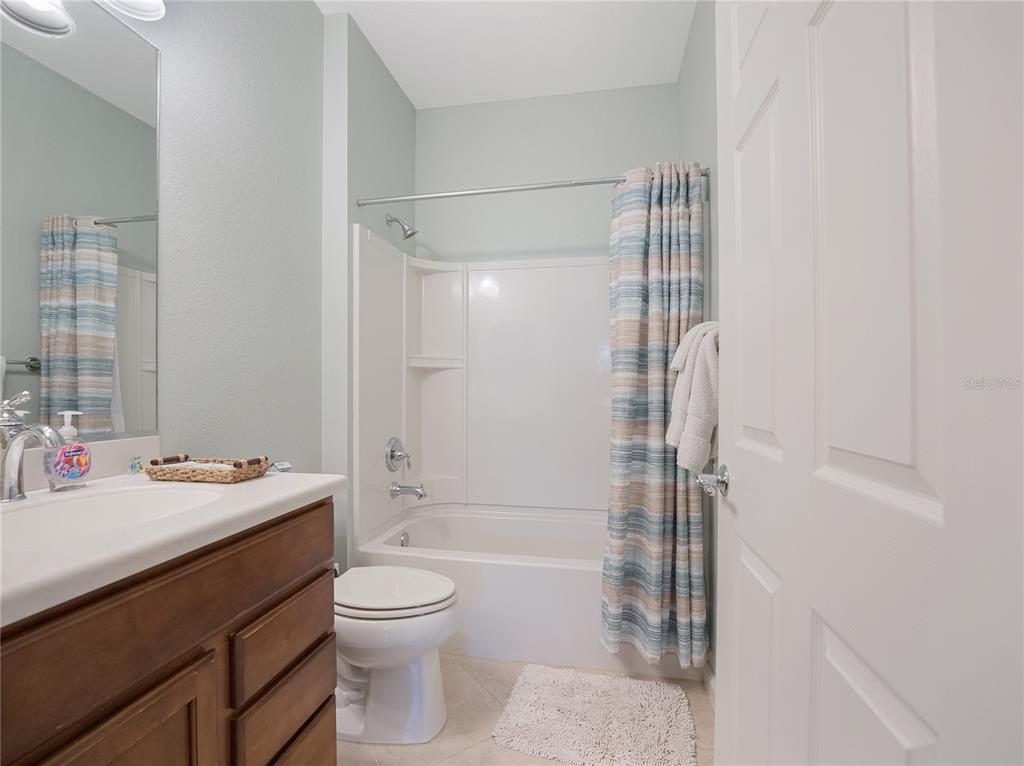 6776 Southwest 91st Circle Ocala, FL 34481 - Photo 48 of 60 a bathroom with a sink a toilet and shower