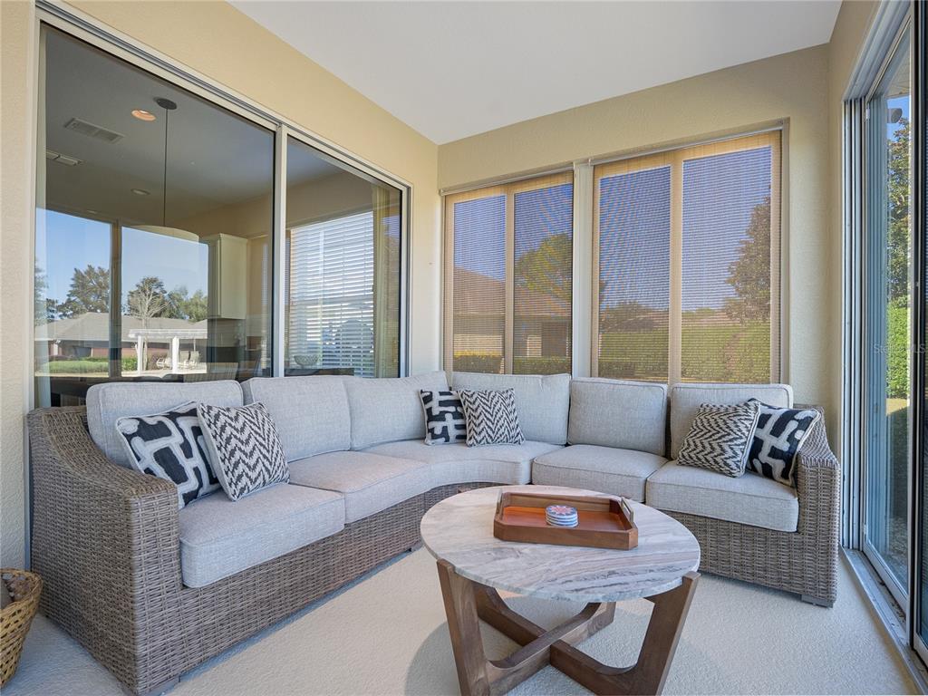 6776 Southwest 91st Circle Ocala, FL 34481 - Photo 52 of 60 a living room with furniture and a large window