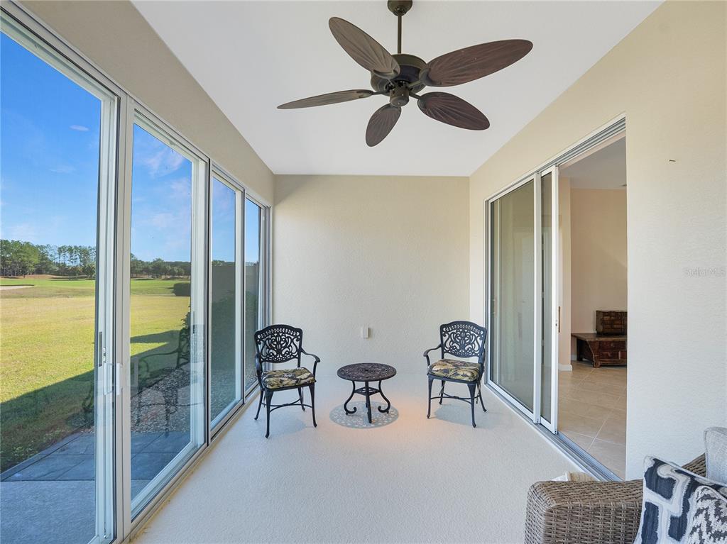 6776 Southwest 91st Circle Ocala, FL 34481 - Photo 57 of 60 a view of a livingroom with couch and a ceiling fan