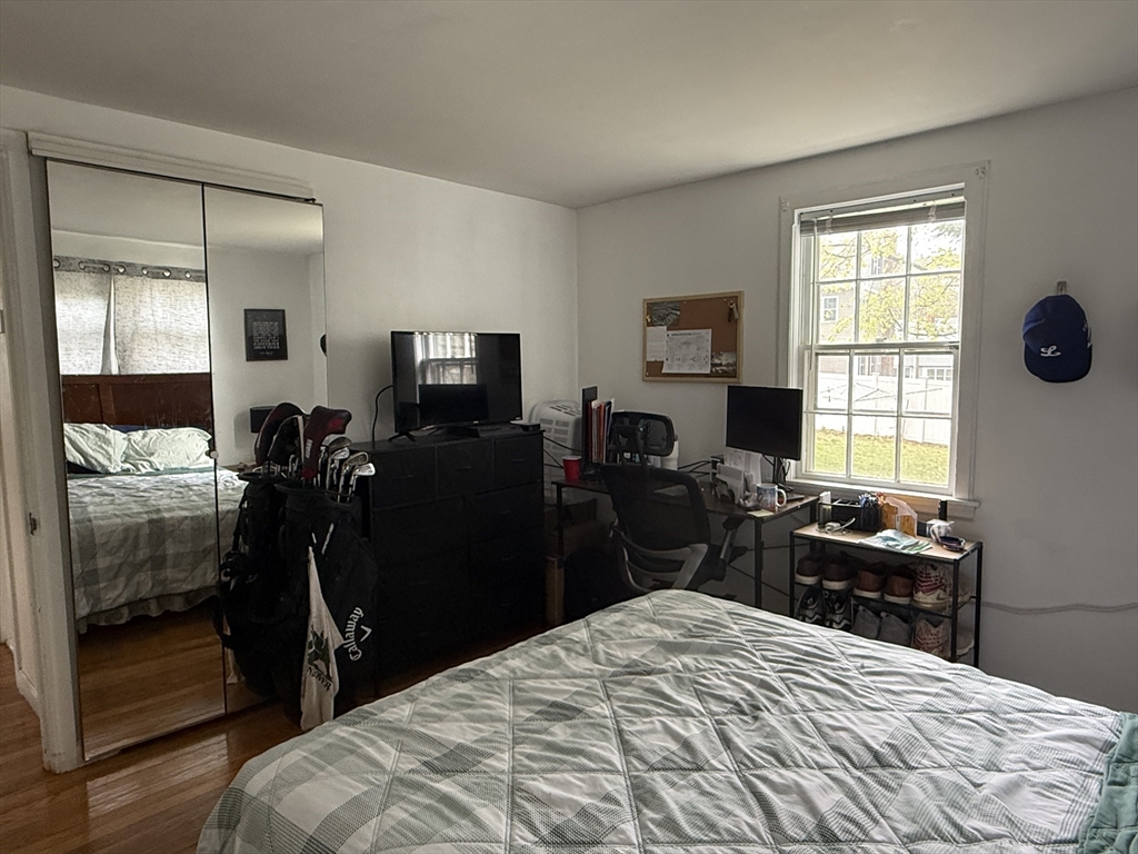 43 Hillcroft Road, Unit 43 Waltham, MA 02452 - Photo 4 of 20 a bedroom with a bed and a window
