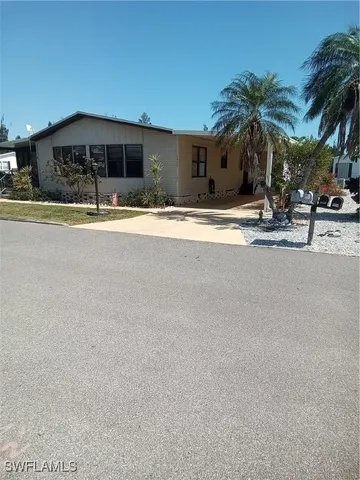 a view of a building with palm trees