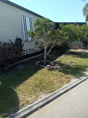 a view of a street with a building in the background