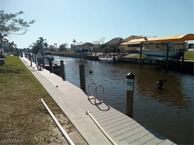 a view of backyard with outdoor seating