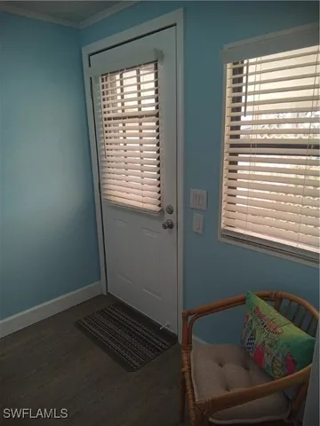 a room with a bed and a window