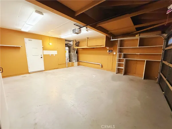 a view of empty room with wooden walls