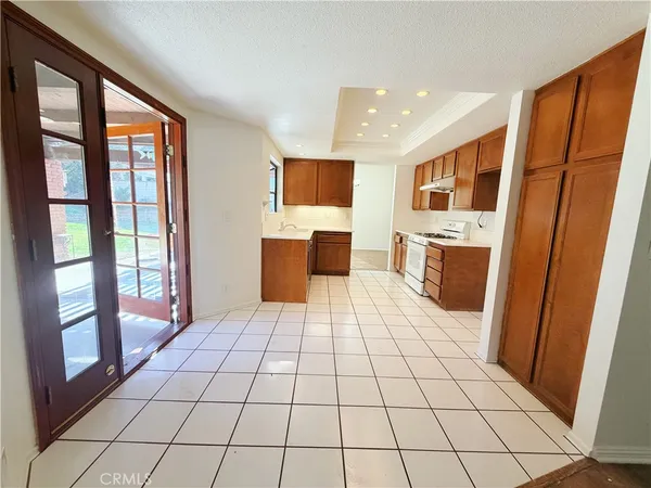 a room with a large window and a table chair
