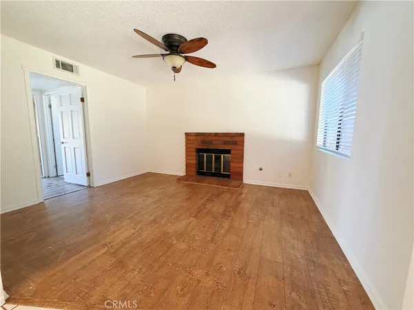 a view of empty room with a ceiling fan