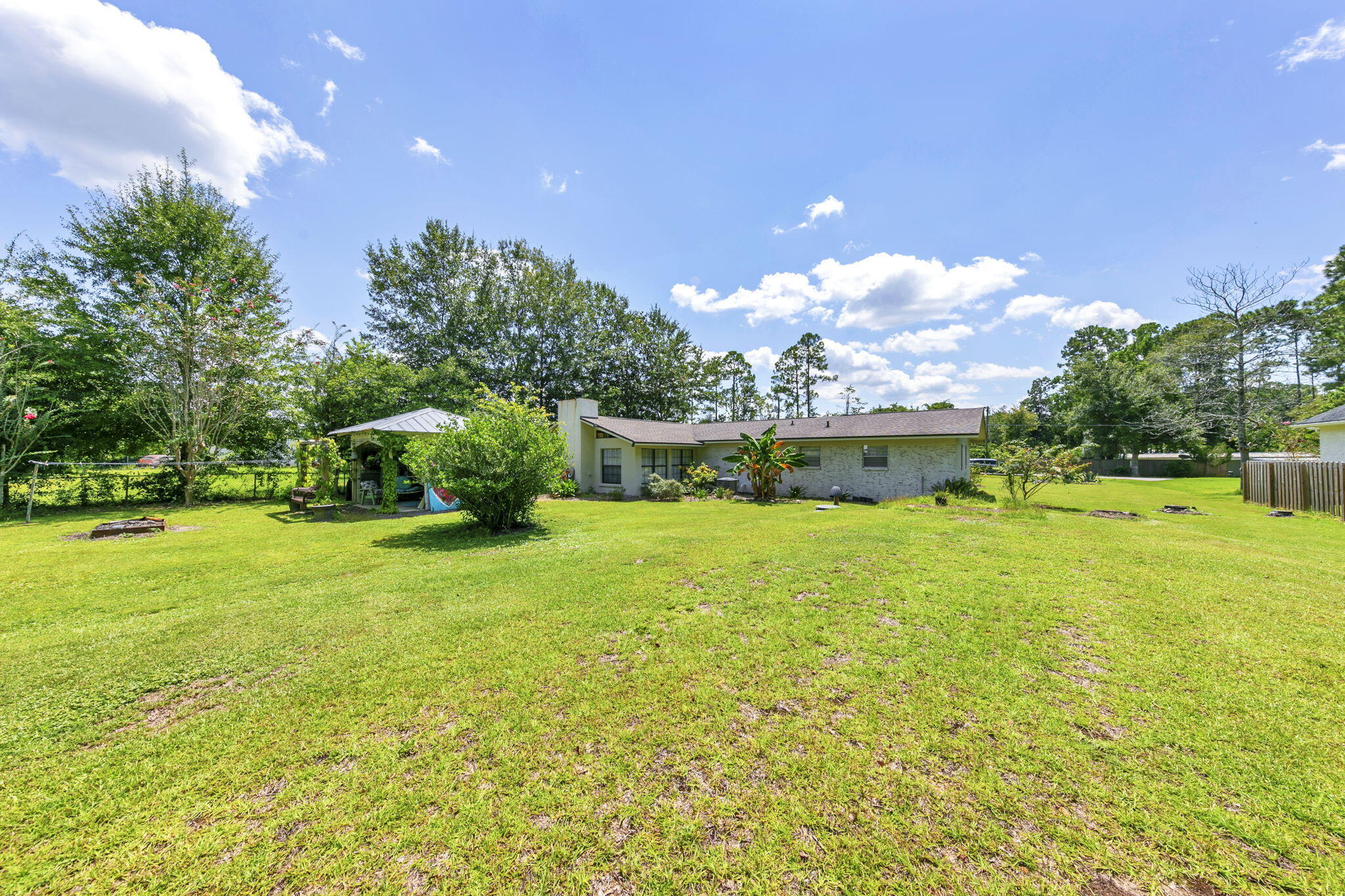 90 Jones Drive Freeport, FL 32439 - Photo 26 of 31 a front view of a house with garden