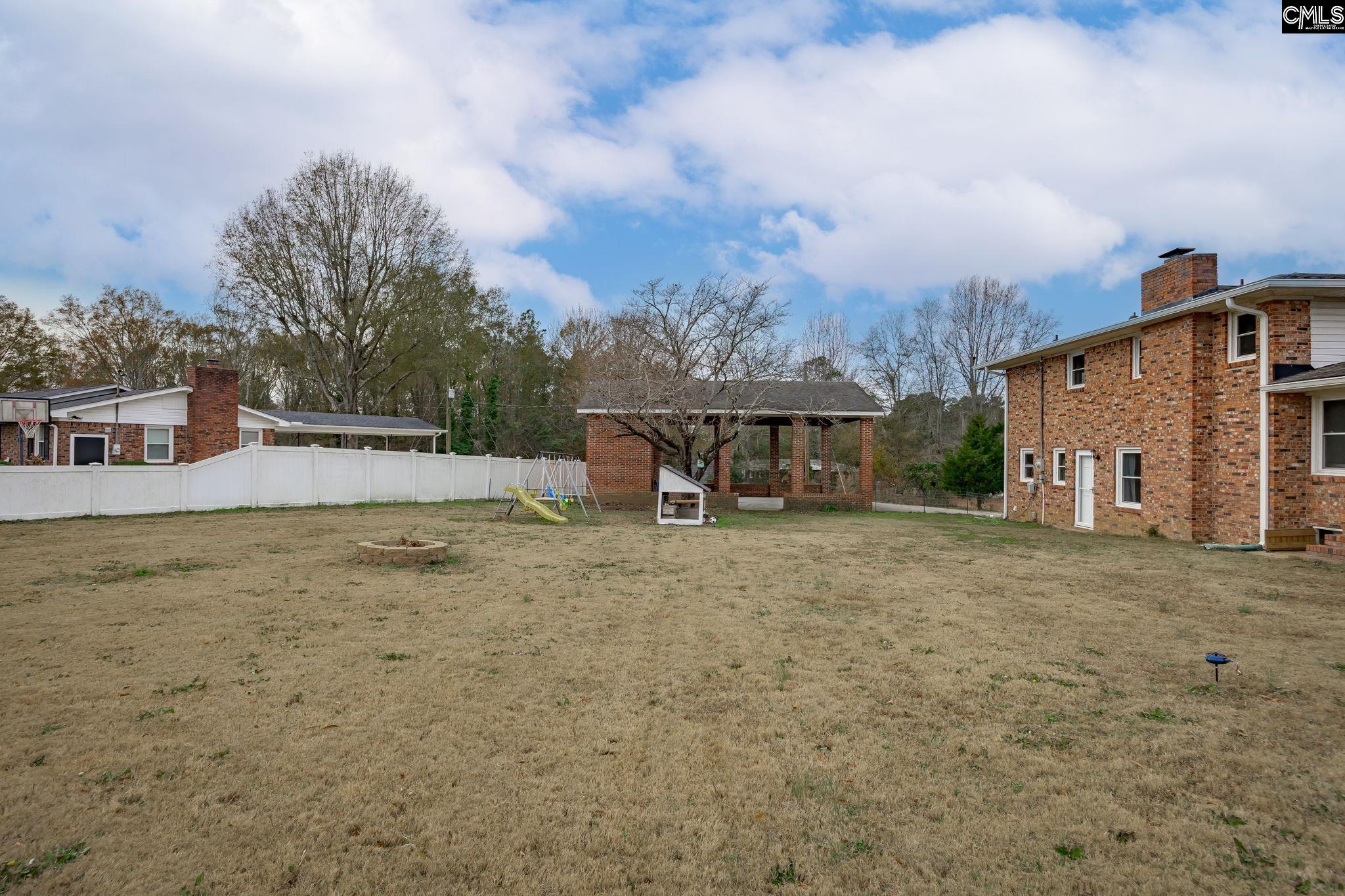 560 Edisto Street Batesburg, SC 29006 - Photo 40 of 49 a view of a house with backyard and sitting area