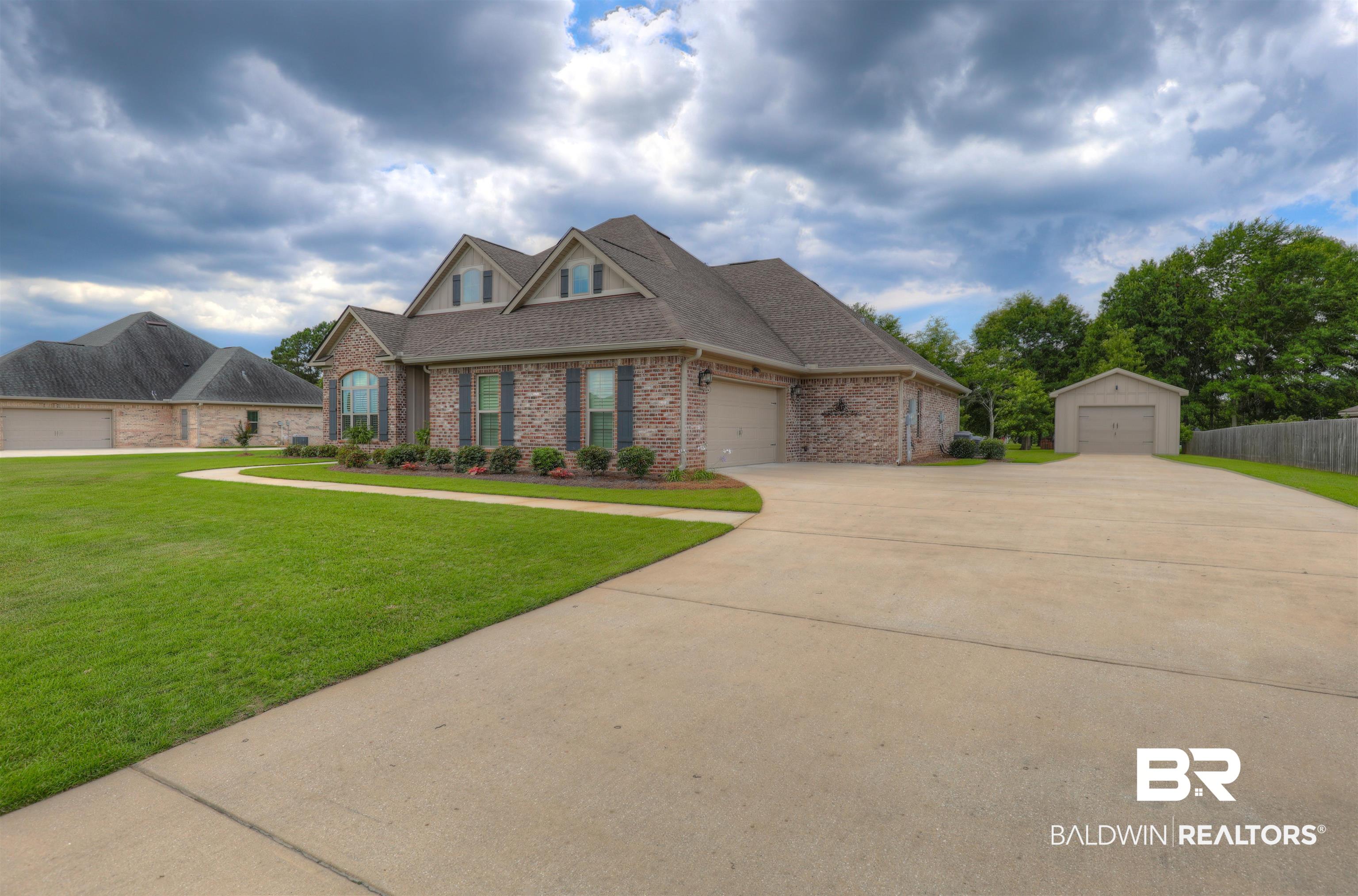 10588 Leesburg Pike Daphne, AL 36526 - Photo 3 of 29 View of front of property with a garage and a front yard