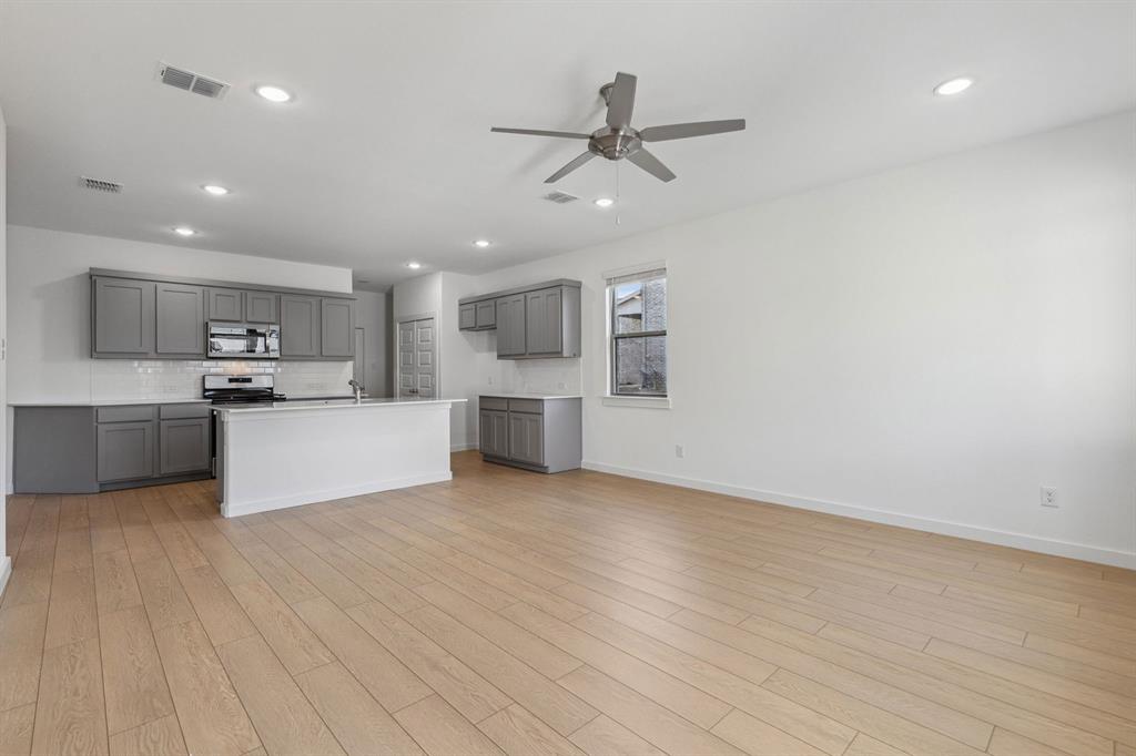 876 Sunflower Road Lavon, TX 75166 - Photo 12 of 31 Living Room in the Oak II home plan by Trophy Signature Homes – REPRESENTATIVE PHOTO