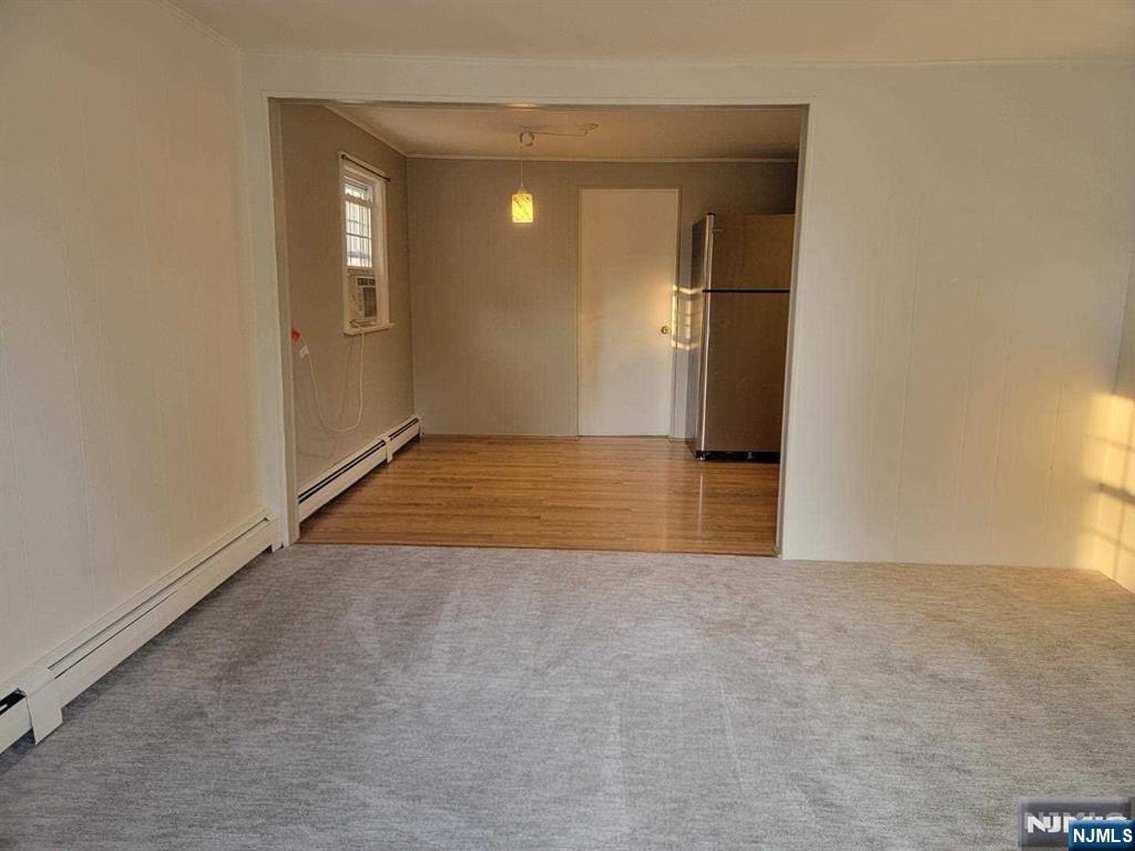 295 Lincoln Avenue Ridgewood, NJ 07450 - Photo 5 of 17 a view of a livingroom with wooden floor and staircase