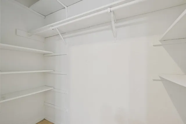 a view of an empty walk in closet