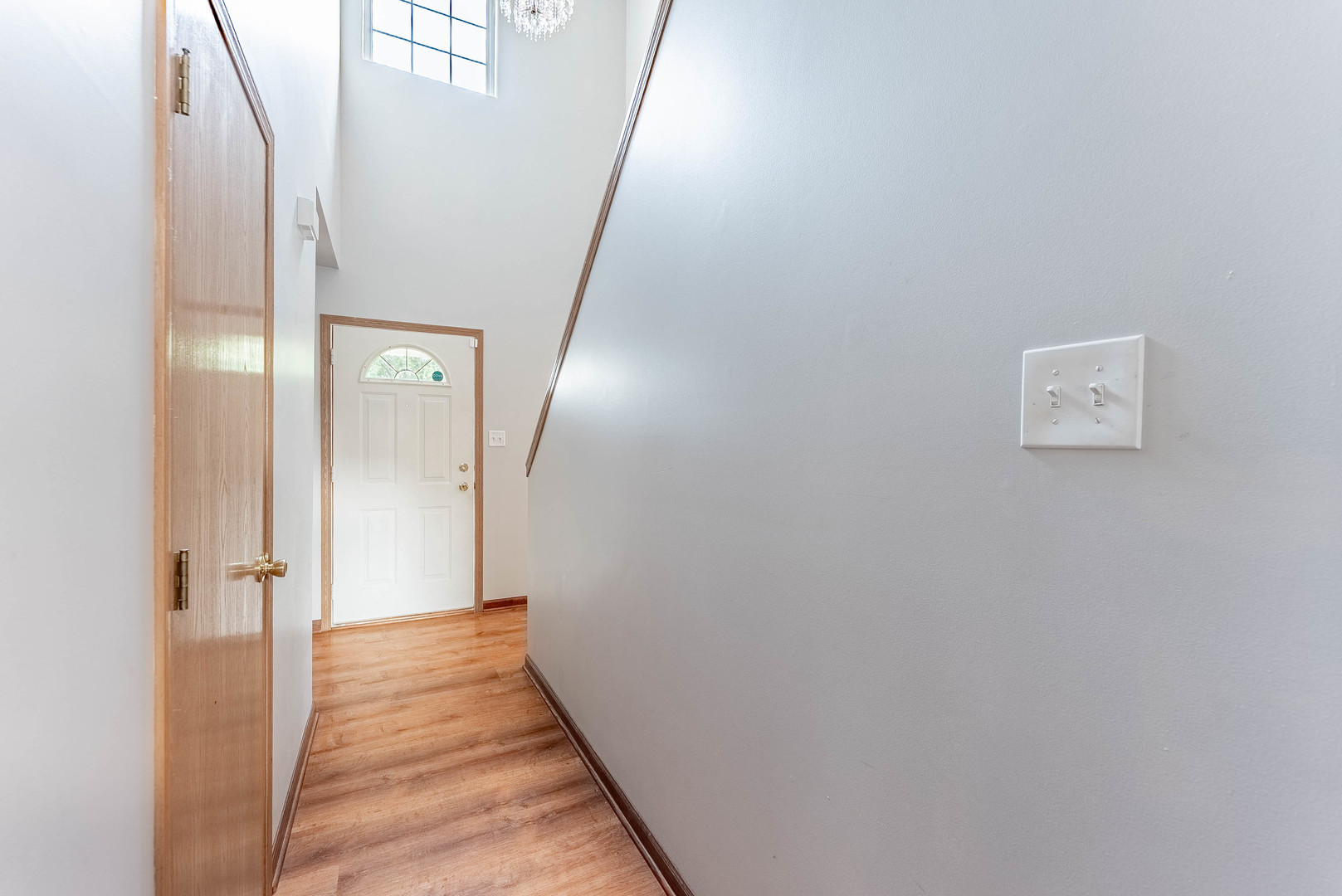 5302 Meadowbrook Street Plainfield, IL 60586 - Photo 12 of 46 a view of a hallway with wooden floor