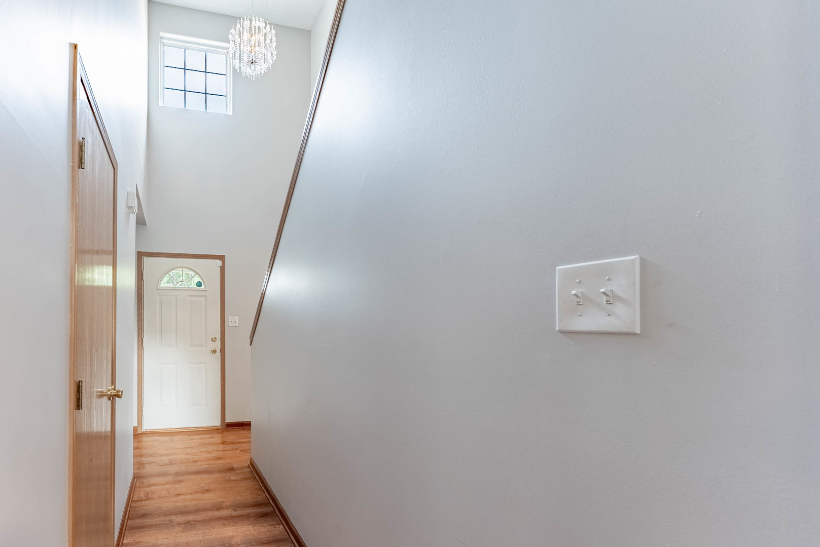 5302 Meadowbrook Street Plainfield, IL 60586 - Photo 18 of 46 a view of a hallway with wooden floor